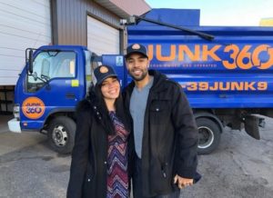 owners of Junk360 standing in front of their truck